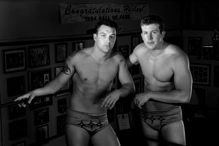 Teddy DiBiase Jr. (right) followed his father, the Million Dollar Man, into wrestling before becoming embroiled in the welfare scandal. He is pictured here with brother Mike; his other brother, Brett, also pursued wrestling and became involved in the scandal.